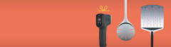 The Ooni thermometer, turning peel and perforated peel on an orange background