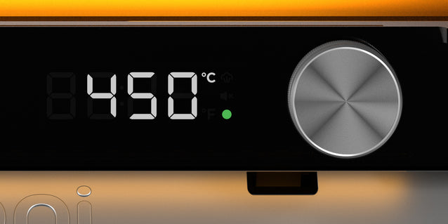 Digital temperature controller displaying 450°C with a knob on an orange background