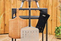 Ooni pizza peels and oven gloves hanging off the modular table