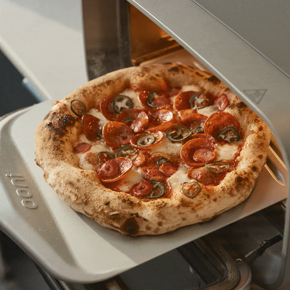 GIF of various items being cooked inside of the Ooni Volt 2 including cookies, salmon, bagels and a pepperoni pizza.