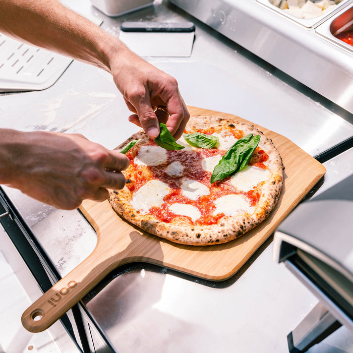 Ooni 12” (30cm) Bamboo Pizza Peel & Serving Board | Click this image to open up the product gallery modal. The product gallery modal allows the images to be zoomed in on.