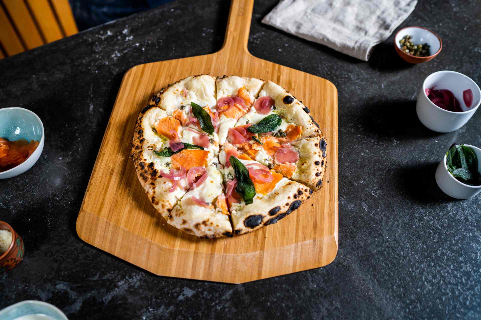 Finnish salmon pizza with capers, onions and citrusy crème fraîche recipe — Ooni Europe