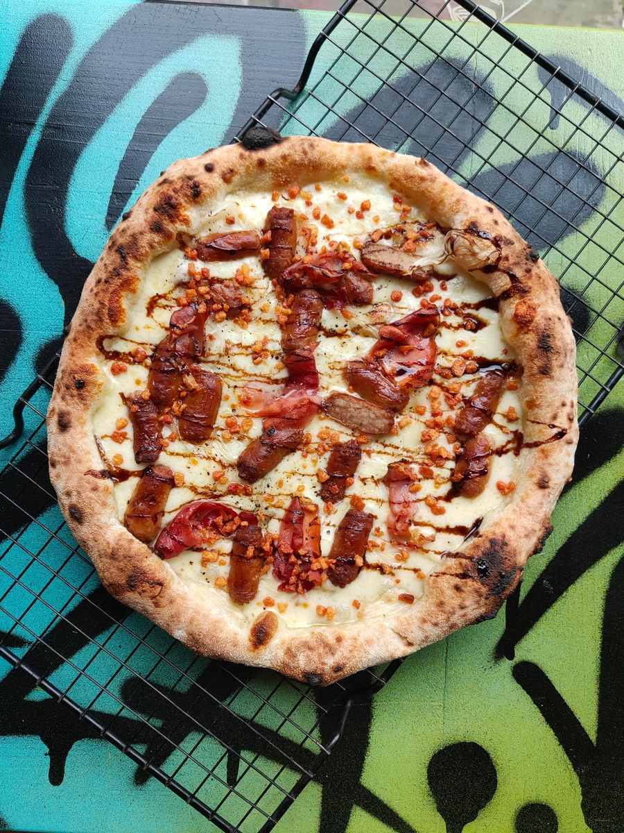 Festive Sausage, Bacon, and Parma Ham Pizza Recipe — Ooni Europe