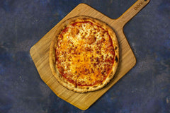 New york style cheese pizza pie on wooden pizza paddle