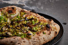 German Brussels Sprouts Pizza with Blue Cheese, Onions and Almonds