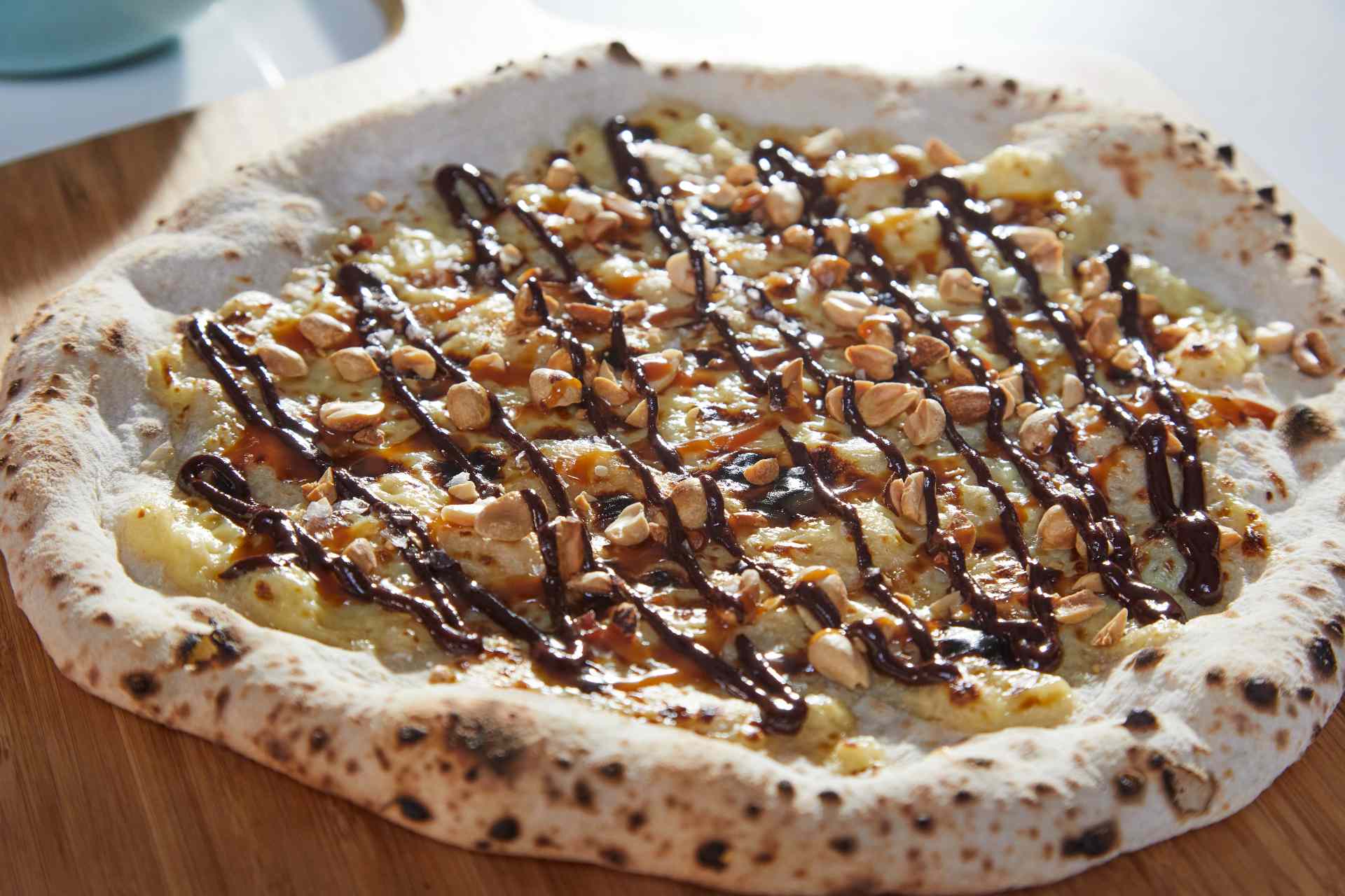 Chocolate, Caramel and Peanut Candy Bar Pizza — Ooni Europe