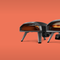 A line up of the Ooni Koda pizza ovens on an orange background