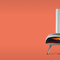 A line up of the Ooni Karu pizza ovens on an orange background