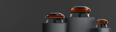 A line up of the Ooni Koda pizza ovens on an orange background