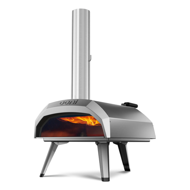 Ooni Karu 12 portable pizza oven with visible flames inside on a white background