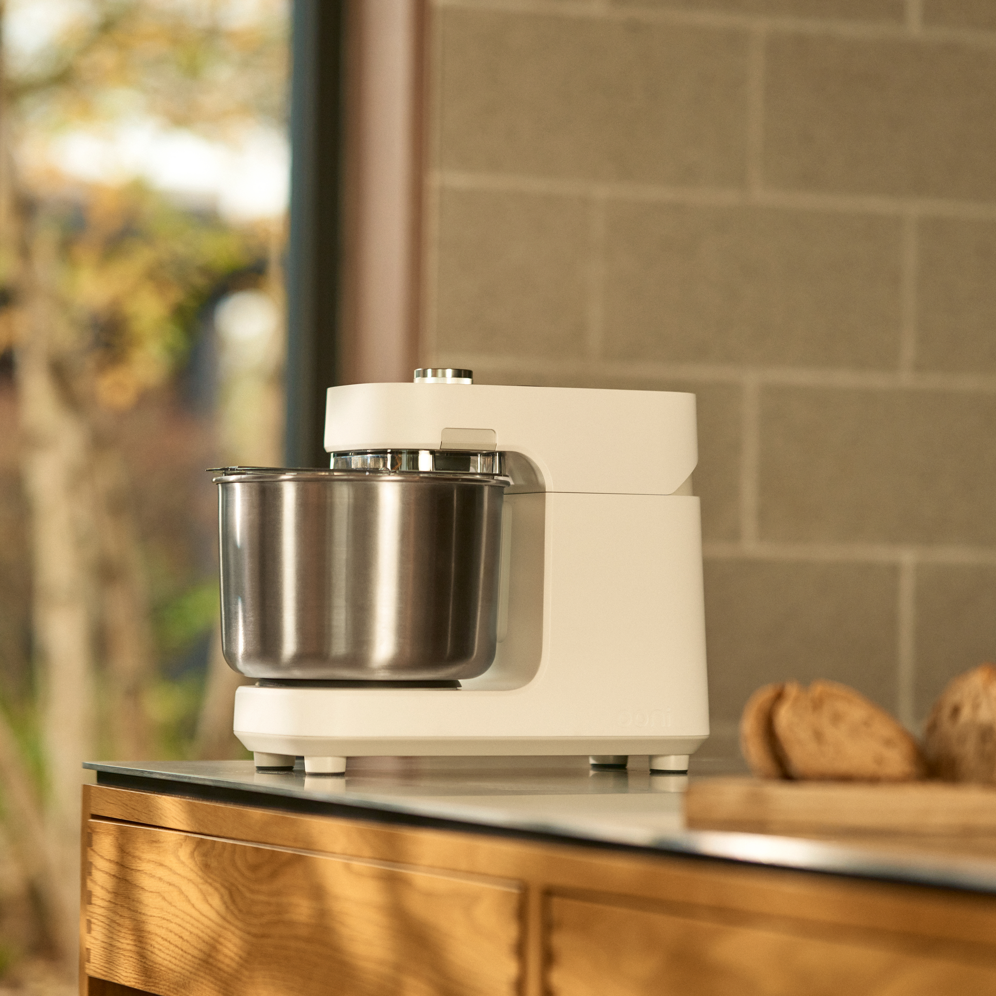 Ooni Halo Pro Spiral Mixer on a countertop with a blurred background