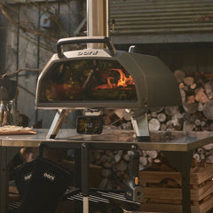 The Karu 2 Pro pizza oven on an outdoor metal table