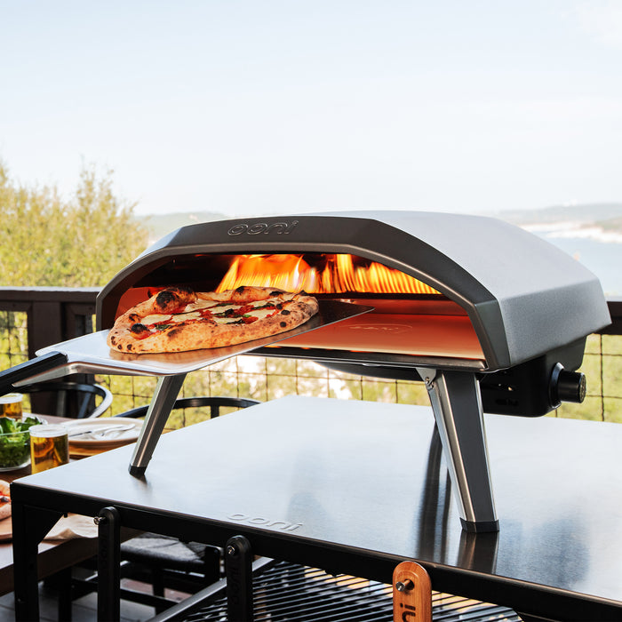 Koda 16 with Pizza Peel on top of Modular Table | Click this image to open up the product gallery modal. The product gallery modal allows the images to be zoomed in on.