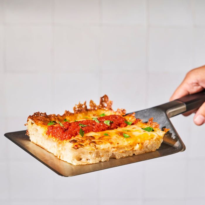 Ooni Pan Pizza Spatula with Detroit Pizza  | Click this image to open up the product gallery modal. The product gallery modal allows the images to be zoomed in on.