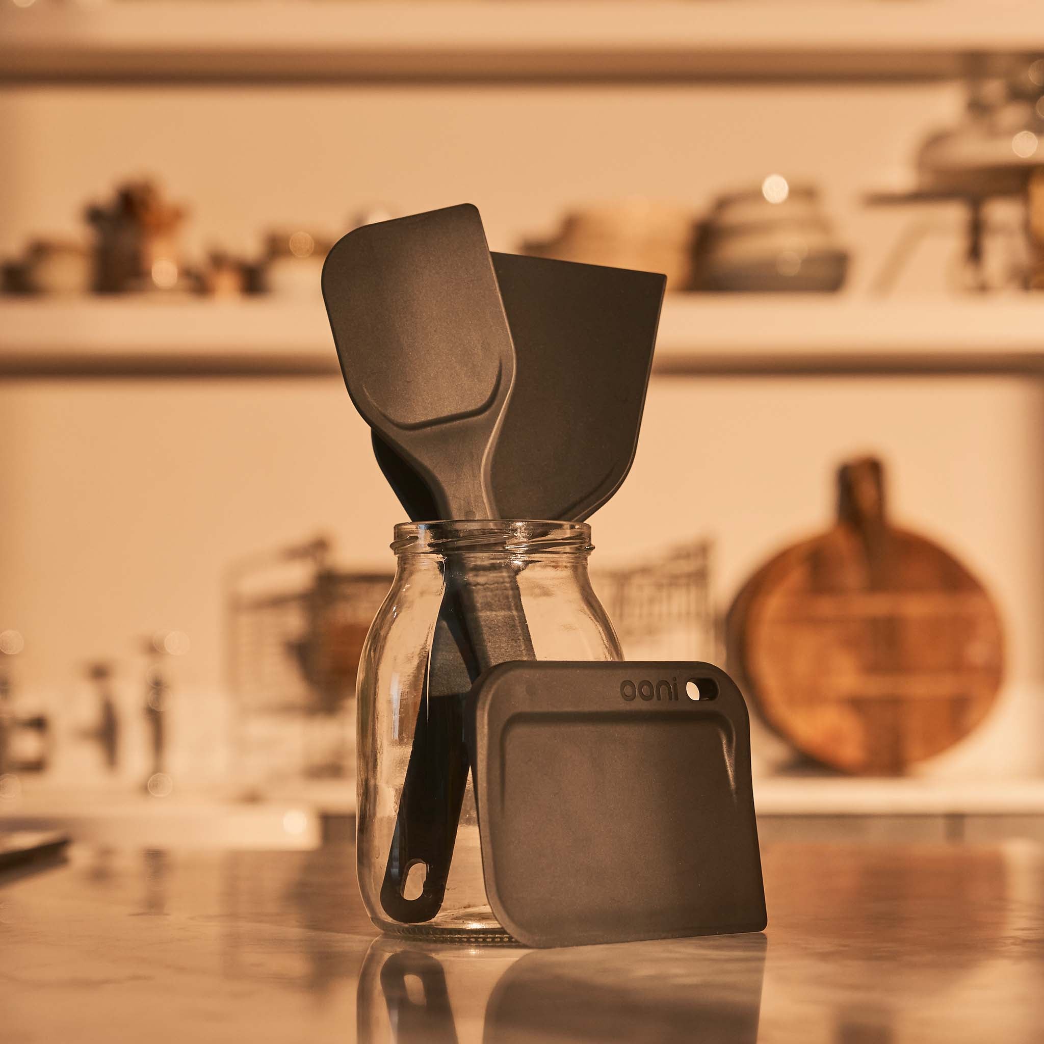Ooni dough tools on a kitchen counter with blurred background