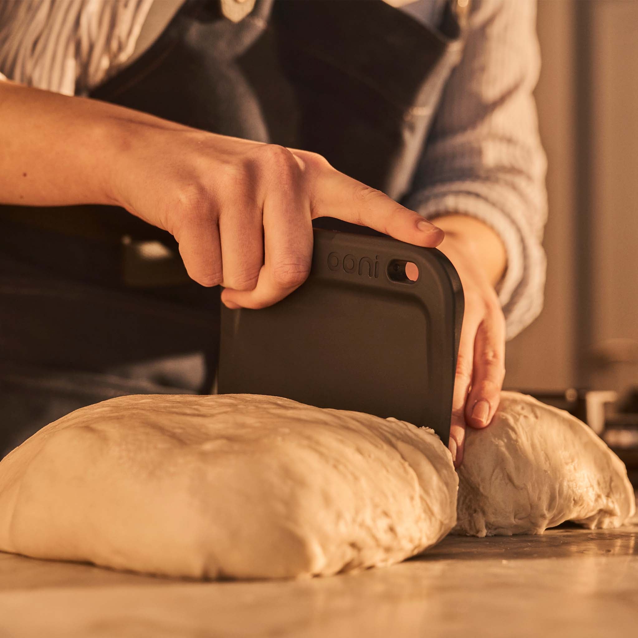 ooni dough bench scraper lifting dough ball from digital measuring scales