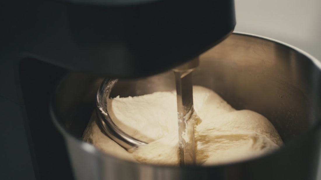A close up video showing the spiral dough hook mixing dough in the Halo Core mixer