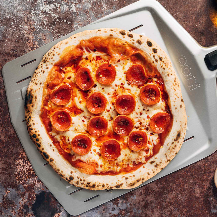 Ooni 12″ (30cm) Perforated Pizza Peel | Click this image to open up the product gallery modal. The product gallery modal allows the images to be zoomed in on.