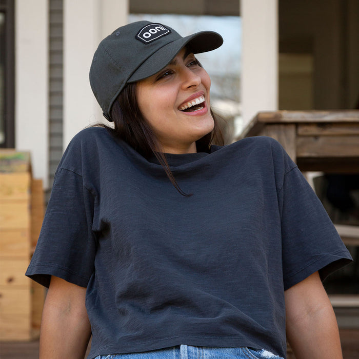 Ooni Badge Grey Dad Hat Lifestyle Shot Front 2 | Click this image to open up the product gallery modal. The product gallery modal allows the images to be zoomed in on.